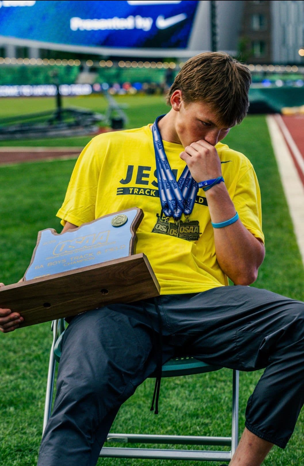 Grant with the OSAA 6A Boys Track & Field champion plaque